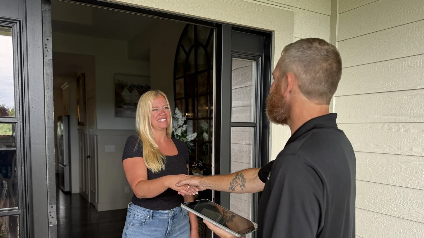 PROJUNK crew member talking with a customer